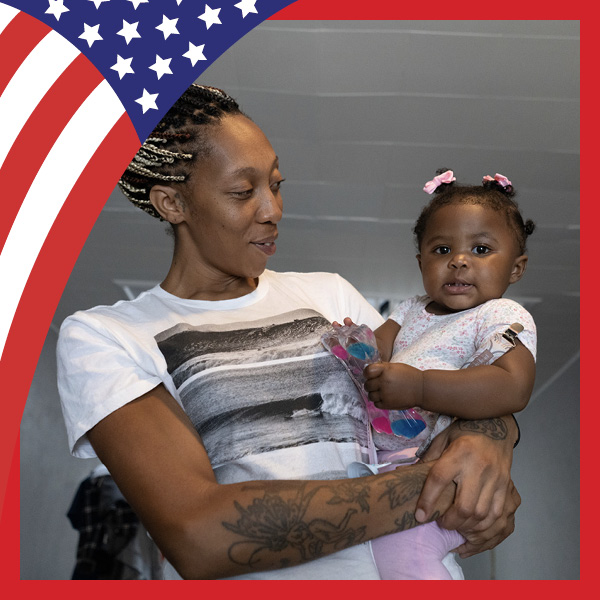 A woman holding a baby