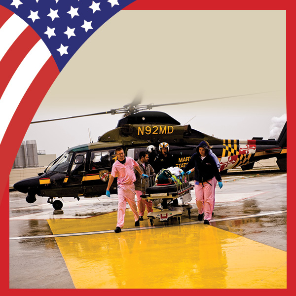 Shock Trauma doctors escorting a patient on the helipad
