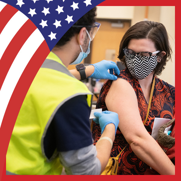 A patient receiving a vaccine on campus at UMB.