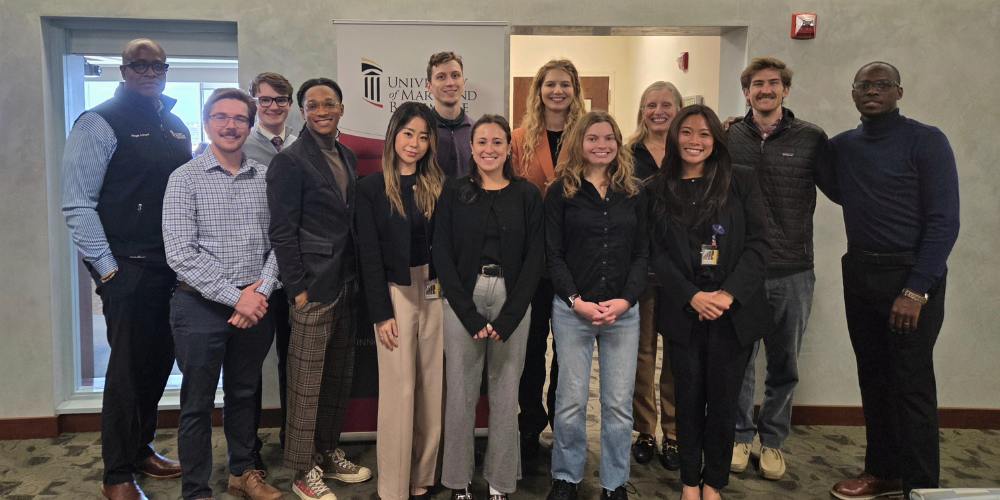The 2025 Provost's Global Scholars pose for a group photo with Provost Dr. Roger Ward.