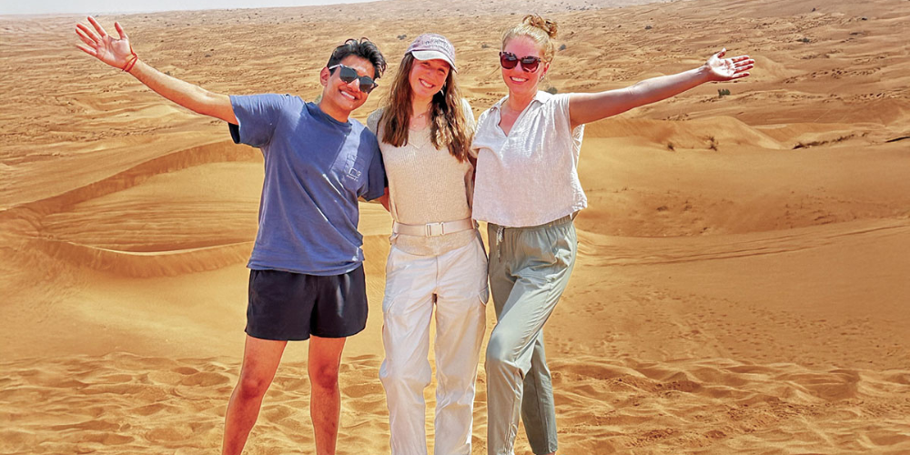 Three students in the desert in Zambia