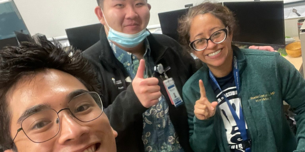Two men and a woman pose for a photo at Guam Regional Medical Center.