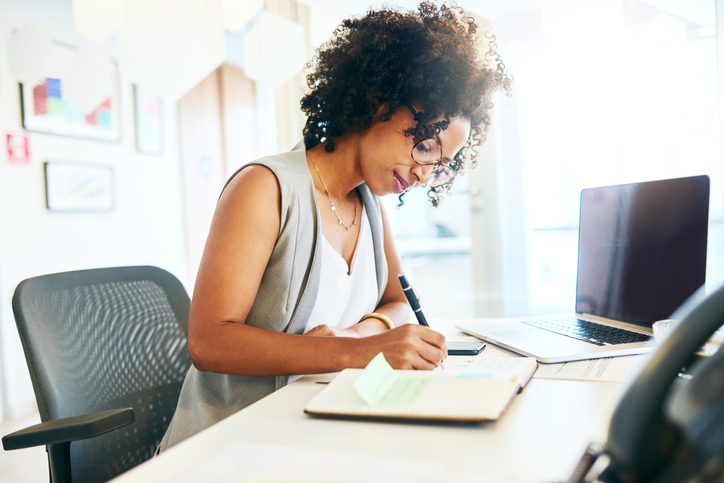 Person working on a piece of paper