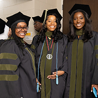 Three graduates