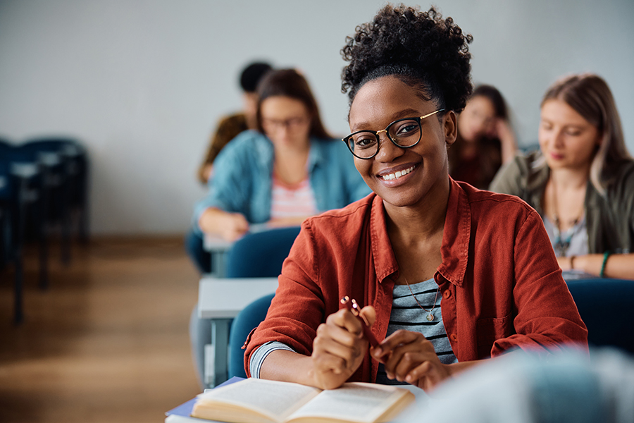 A smiling student in a classroom