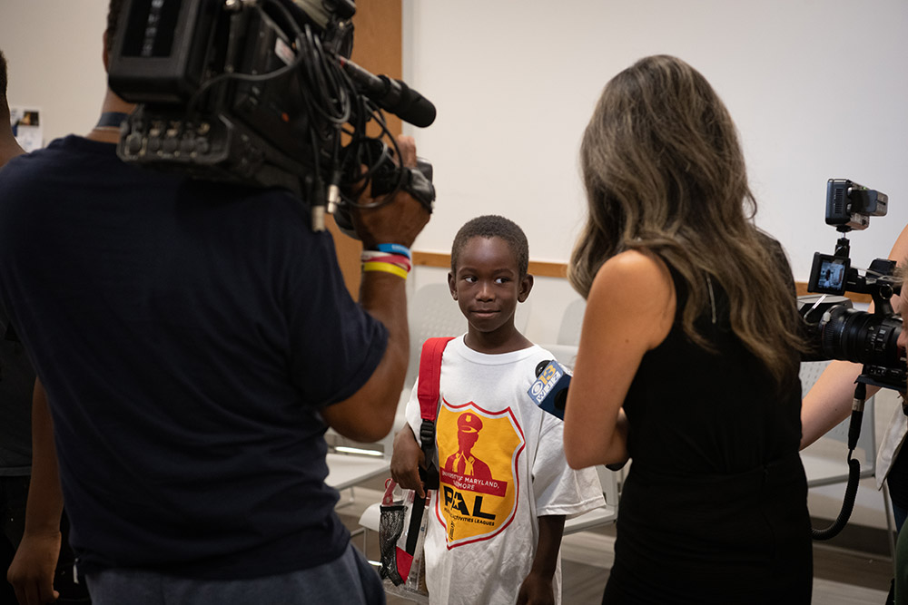 news media talks with school child