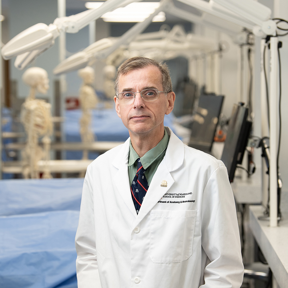 Adam C. Puche, PhD