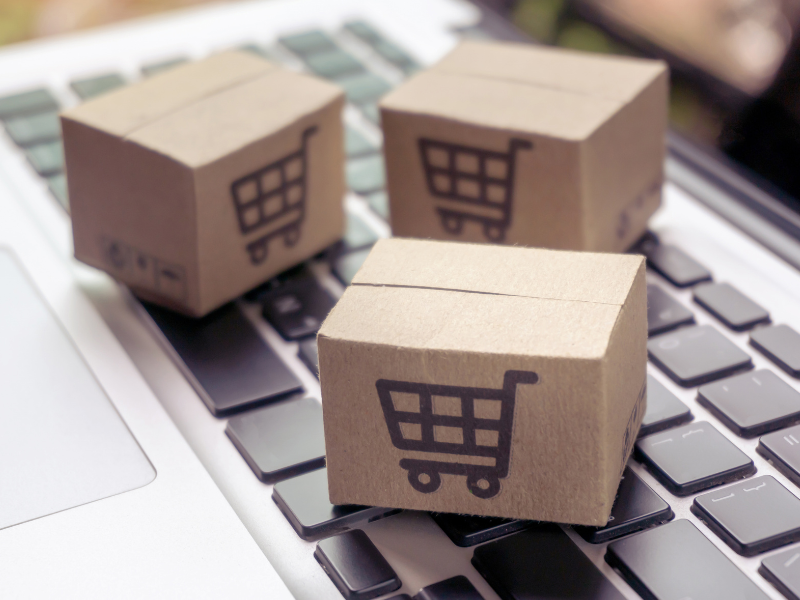 Shipping boxes on a laptop keyboard