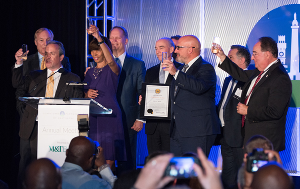 Toasting downtown success are (left to right) Peter Franchot, Kirby Fowler, Catherine Pugh, Kevin Pearson, Mike Murchie, Augie Chiasera, Amer Hammour, and Jay Perman.

