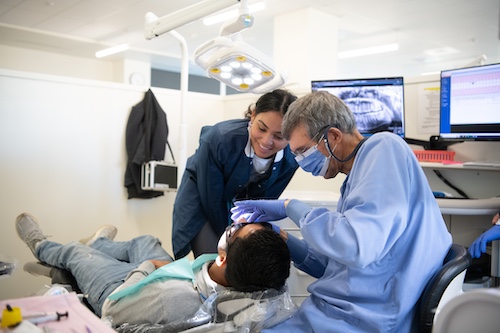 Volunteers from the School of Dentistry provide care at the Baltimore Mission of Mercy clinic, a partnership with the United Way of Central Maryland that offers free dental services to underserved patients. Efforts like this helped the University of Maryland, Baltimore earn the Carnegie Community Engagement Classification.