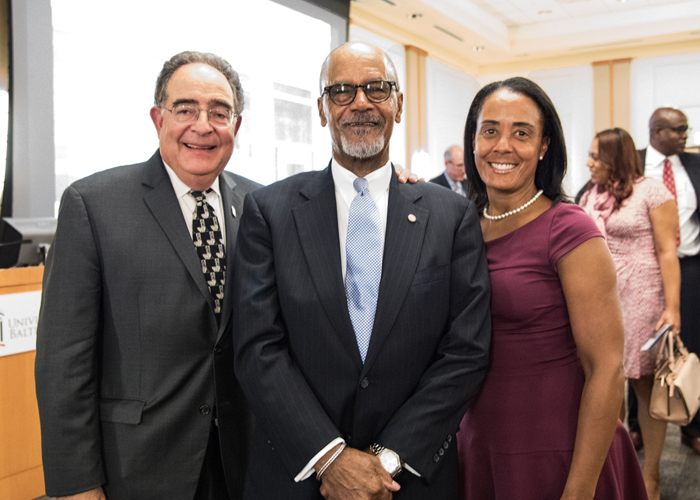 Jay Perman, MD, the president of the University of Maryland, Baltimore (left), and Elsie Stines, DNP, CRNP, member of the Diversity Advisory Council (right), greet John Wolfe Jr., PhD, MS (center), after his presentation on 'Managing Conflict: Cooperating and Collaborating Even When We Disagree.'