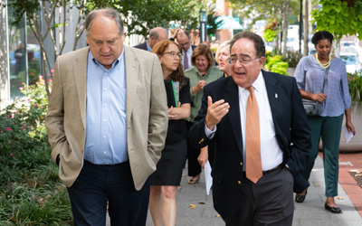 UMB President Jay A. Perman, MD leads Montgomery County Executive Mark Elrich on a tour of the UM BioPark