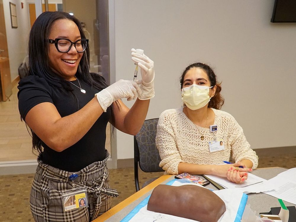 UMSOP students participate in a workshop on administering maintenance injectable medications