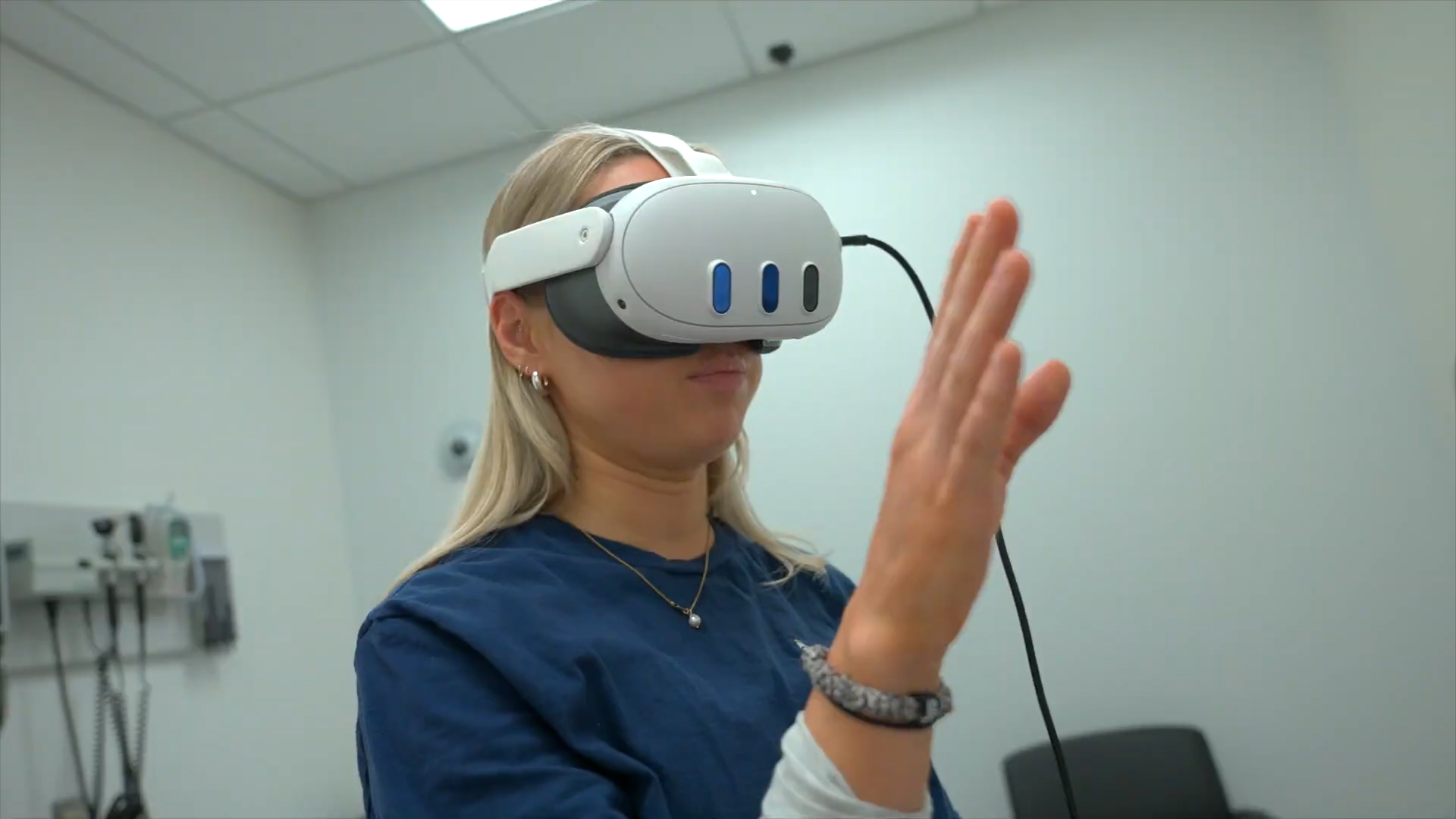 A student wearing VR goggles participates in a virtual exam