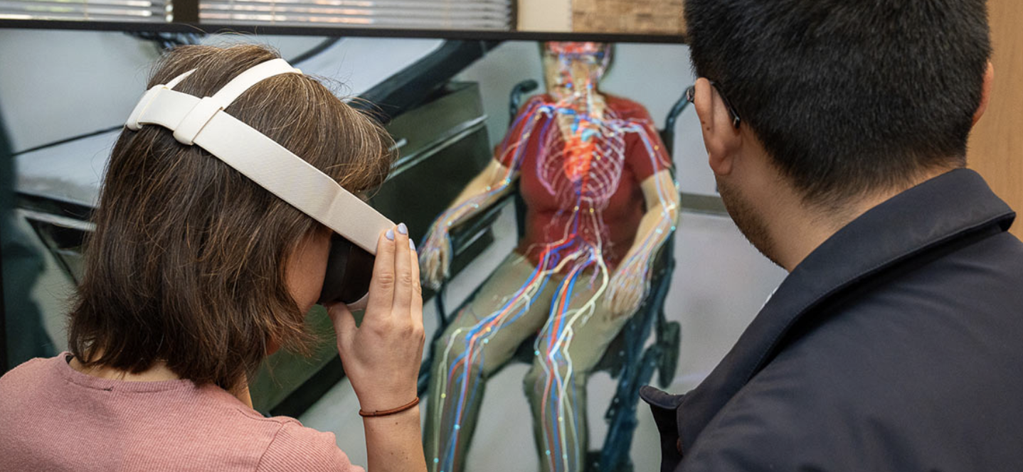 A woman with virtual reality goggles views a visualization of the human circulatory system