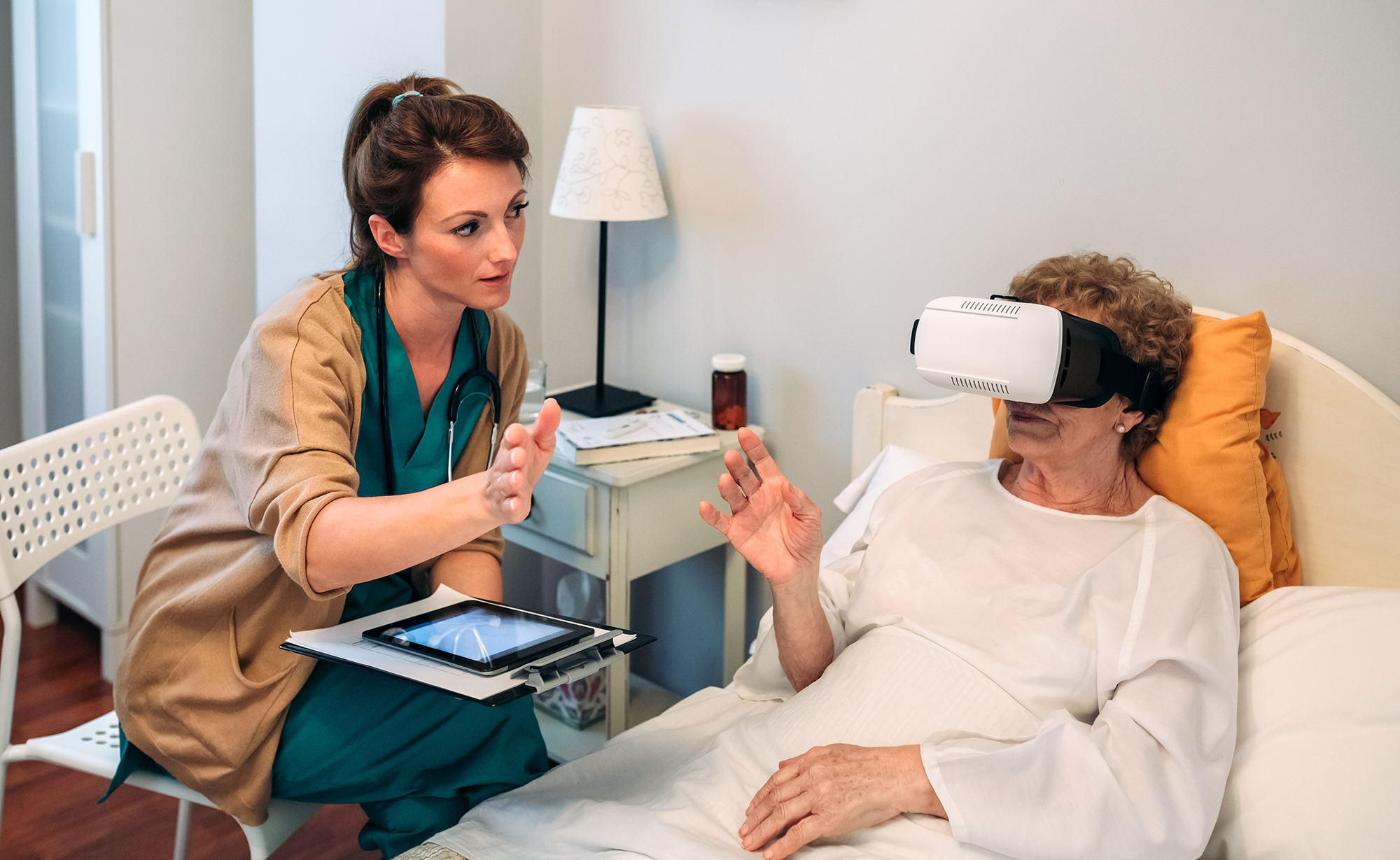 Brittany Burch using a VR headset to help a patient exercise.