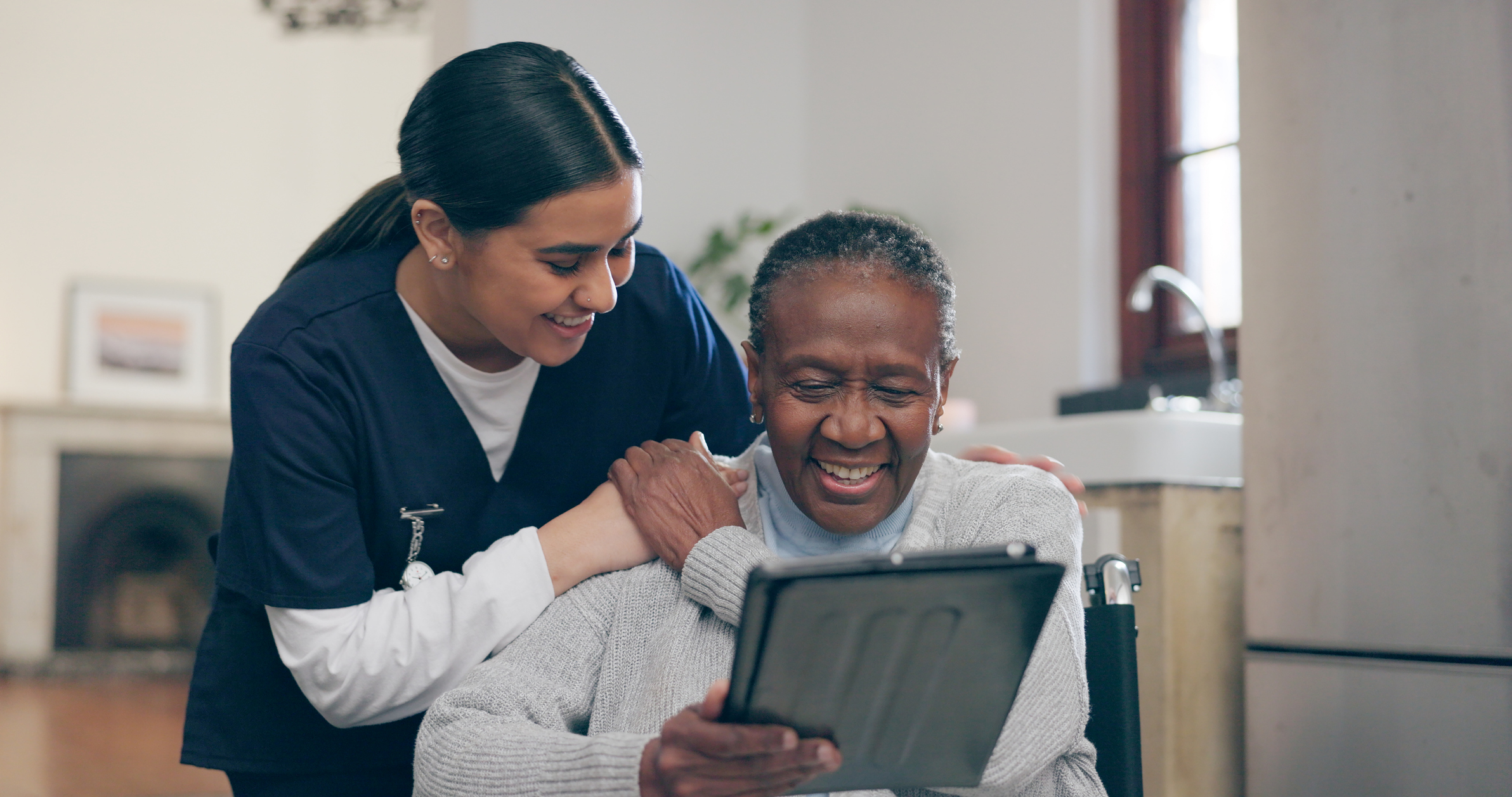 A senior patient interacting with a nurse